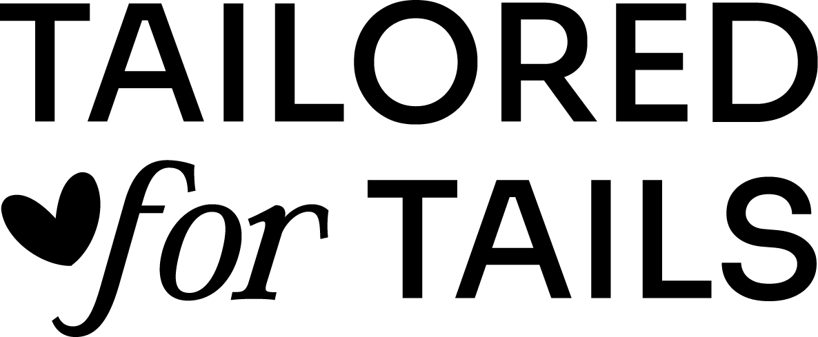 Ginnabelle's "Tailored for Tails" brand wordmark with heart motif.